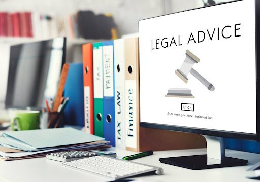 Legal advice webpage on a computer in a law office setup.
